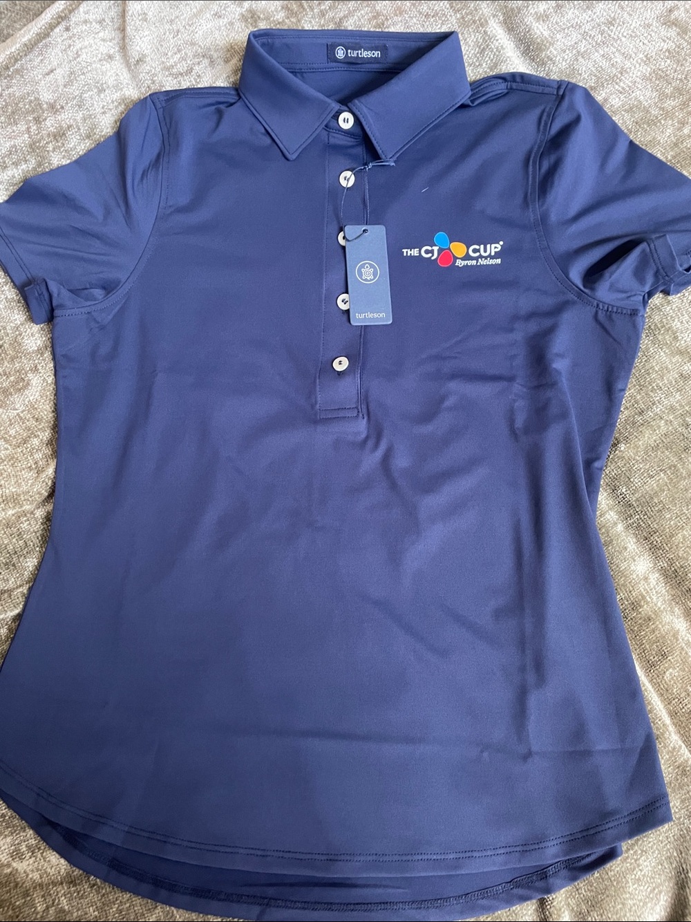 Turtleson Women's Navy Polo with The CJ Cup Logo
